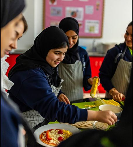 Young girls taking a cooking class