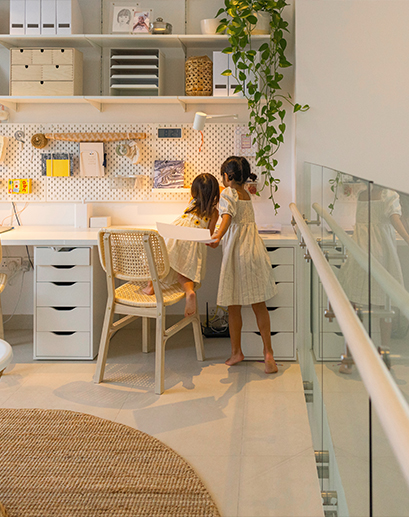 Two little girls sitting at a desk